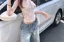 Knot Asymmetrical Lace Cropped Halter Top / Low Rise Washed Wide Leg Jeans