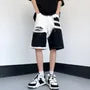 Mid Rise Distressed Panel Denim Shorts